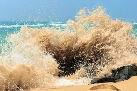High wave breaking on the rocks of the coastlineの写真素材
