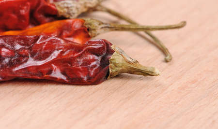 Peppers on wooden boardの写真素材