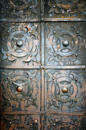 Fragment of old door as background. Metal doorの写真素材