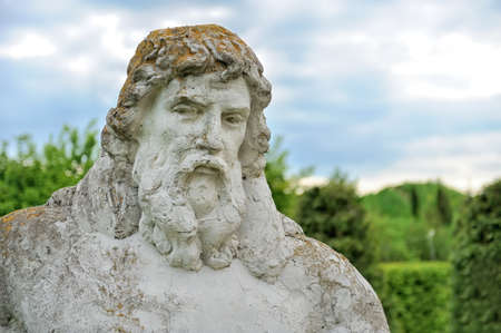 Big statue Neptune from stone in spring gardenの写真素材
