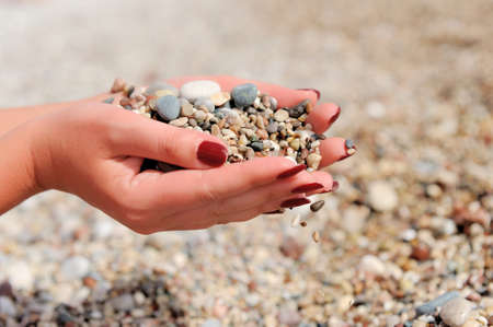 Handful of stones in handsの写真素材