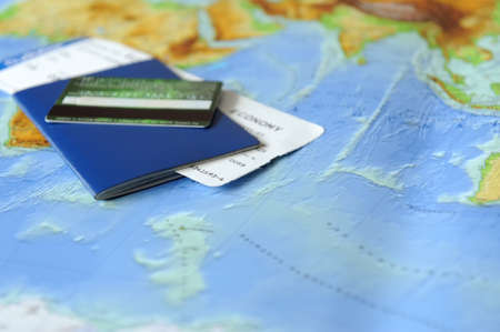 Passport and ticket  on a background map of the world. Traveling conceptの写真素材