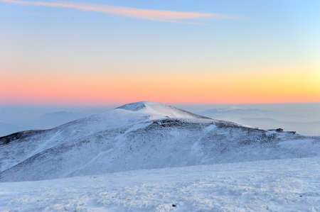 Sunset in the winter mountains landscapeの写真素材