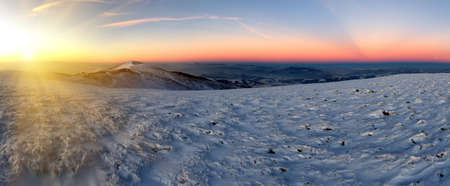 Sunset in the winter mountains landscapeの写真素材