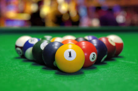 Billiard balls in a green pool table