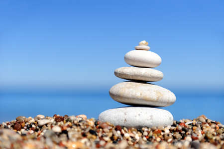 Stack of pebble stones at the beachの写真素材