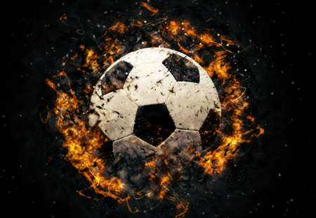 Close-up soccer ball in fire on dark backgroundの写真素材