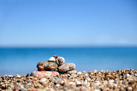 Stack of pebble stones at the beachの写真素材