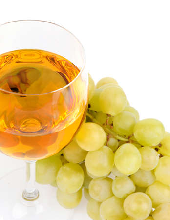 Branch of grapes and glass of wine isolated on white backgroundの写真素材