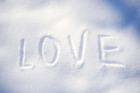 Writing text LOVE on the snowの写真素材