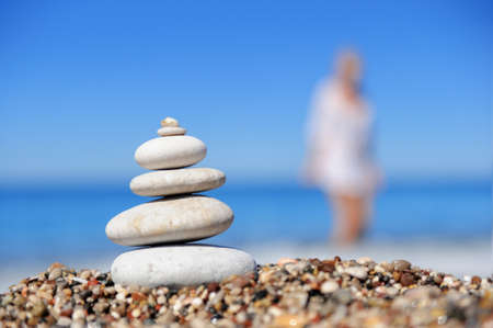 Stack of pebble stones at the beachの写真素材