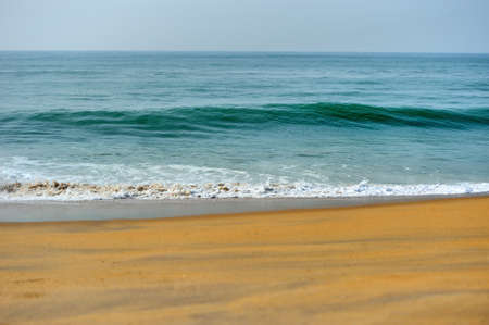 Wave of the ocean on the sand beachの写真素材