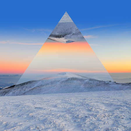 Winter mountain landscape at sunset. Geometric reflections effectの写真素材