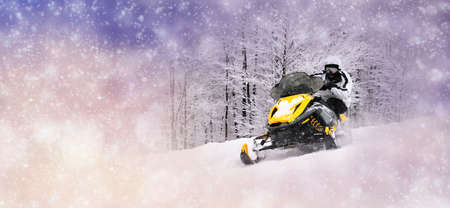 Winter background with man on snowmobile. Christmas conceptの写真素材