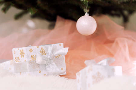 Christmas home decoration with gifts and ball on treeの写真素材