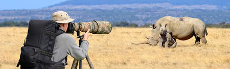Professional wildlife photographer taking Rhino shotの写真素材
