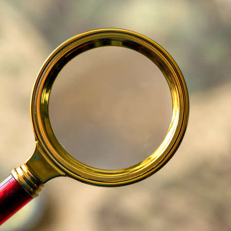 Retro magnifier with old map closeup