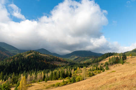Amazing mountain landscape with colorful vivid sunset on the blue sky. Natural outdoor travel backgroundの写真素材