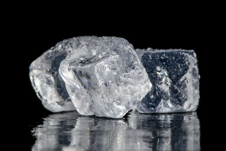 Ice cubes square with drops water clean on black backgroundの写真素材