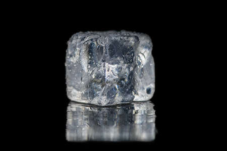 Ice cubes square with drops water clean on black background