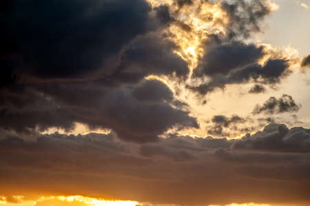 Dynamic sky with dark clouds on sunset
