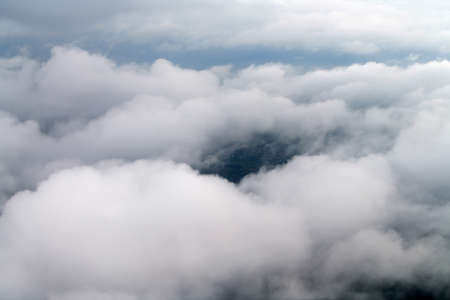 Landscape from the cockpit of an aircraft. Sky with clouds