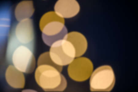 Abstract blurred bokeh light with warm tone color background concept