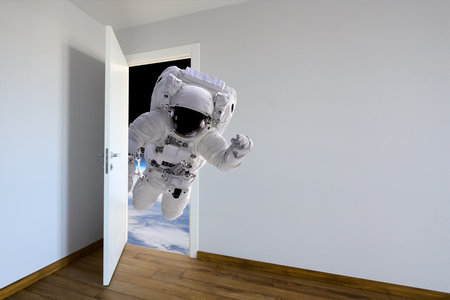 Astronaut entering a door. Animal watching from a wall. Kids decoration room. Child's imagination or a dream.の写真素材