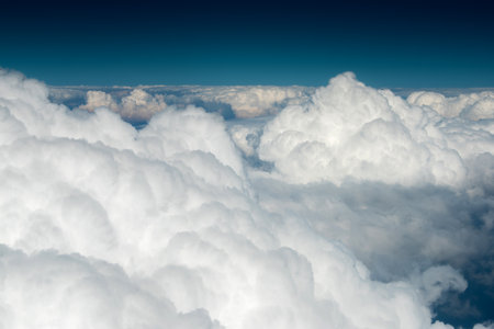 Landscape from the cockpit of an aircraft. Sky with cloudsの写真素材
