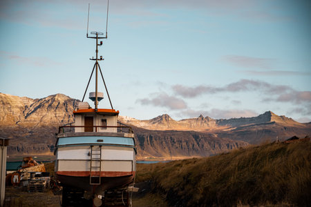 Landscape of fishing village in iceland with a boat as the main subject and blurred backgroundの写真素材