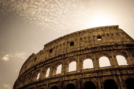 View of Colosseum in front of sun, Italy, Europe.の写真素材
