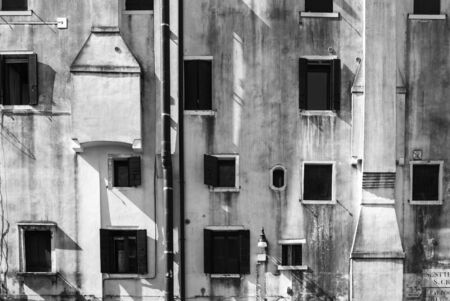 A facade with randomly arranged windows/window facadeの写真素材