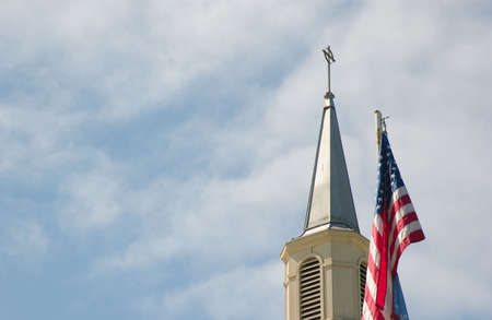 church steeple and american flagの写真素材