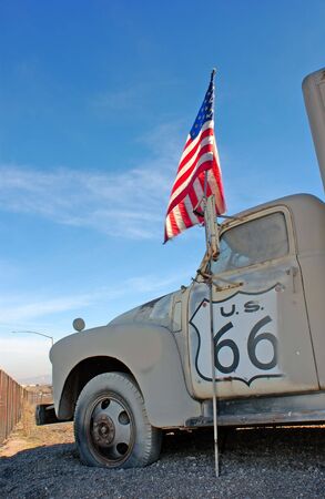 truck and flag on historic rout 66の写真素材