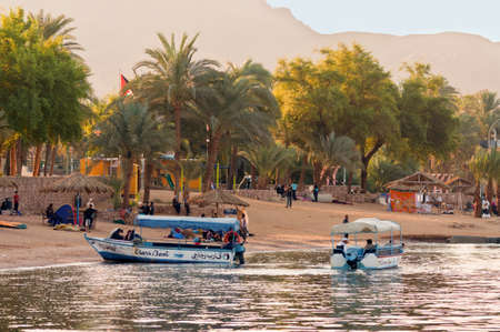 Aqaba, Jordan - November 20, 2010: Jordanian boatmen waiting for tourists at November 20, 2010 in...