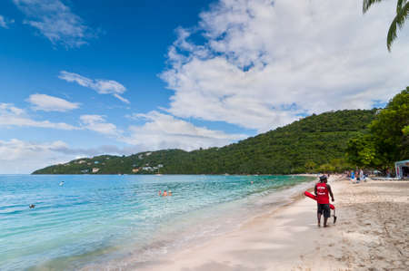 Magens Bay St. Thomas U.S. Virgin Islands  December 5 2011: A red cross lifeguard is patrolling the Magens Bay beach St. Thomas U.S.V.I.のeditorial素材