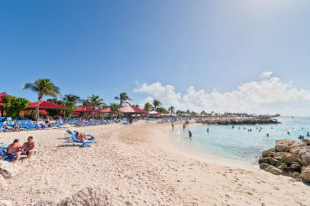 Eleuthera, Bahamas - December 7, 2011: Tourists enjoy a sunny day on the sandy beach of Princess Cays, Eleuthera in the Bahamas on December 7, 2011.のeditorial素材