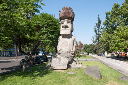 Santiago, Chile - December 2, 2012: Moai are rock sculptures from eastern islands. Until today they remain a mystery. The statue of this Moai sits on Alameda in downtown Santiago de Chile.のeditorial素材