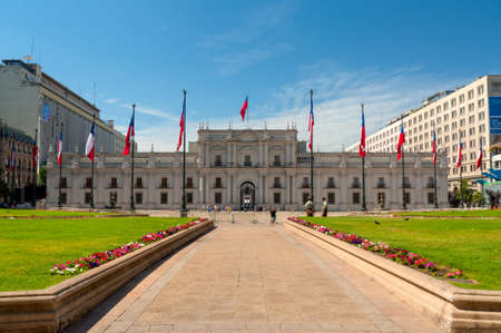 Santiago, Chile - December 2, 2012: People visit the Palacio de la Moneda in Santiago, Chile. The palace was opened in 1805 as a colonial mint, but later became the presidential palace.のeditorial素材
