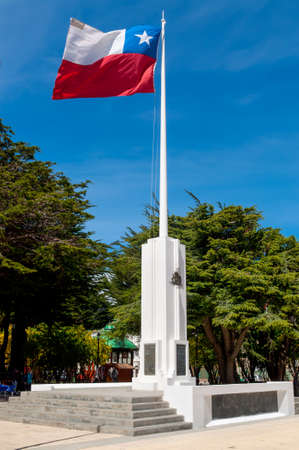 Punta Arenas, Chile - December 9, 2012: Chilean flag against blue sky in Plaza de Armas, Punta Arenas, Magallanes Region, Chile.のeditorial素材