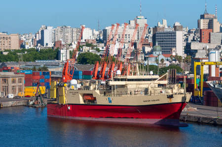 Montevideo, Uruguay - December 15, 2012: Research and survey vessel Ramform Vanguard in the Port of Montevideo, Uruguay at December 15, 2012. Montevideo in the background.のeditorial素材