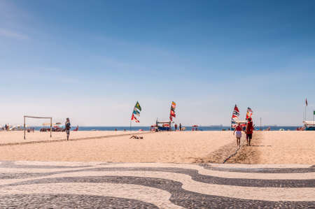 Rio de Janeiro, Brazil - December 21, 2012: Tourists and local people enjoying life at the beach at Copacabana Beach, Rio de Janeiro.のeditorial素材