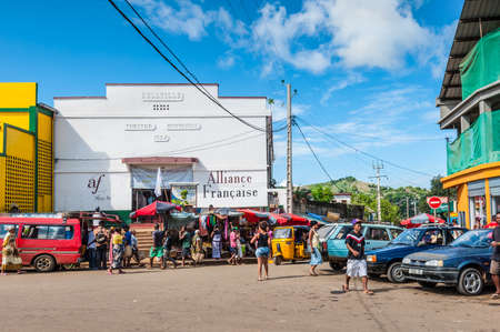 Hell Ville, Madagascar - December 19, 2015: Malagasy people near the Municipal Theatre in Hell Ville, a town at the Nosy Be island, North of Madagascar. Built in 1954.のeditorial素材