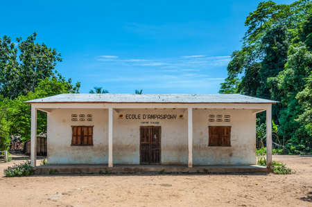 Ampasipohy, Nosy Be, Madagascar - December 19, 2015: The school cantine and post office building in the village of the Ampasipohy, Nosy Be Island, Madagascar. Children on Christmas vacation.のeditorial素材