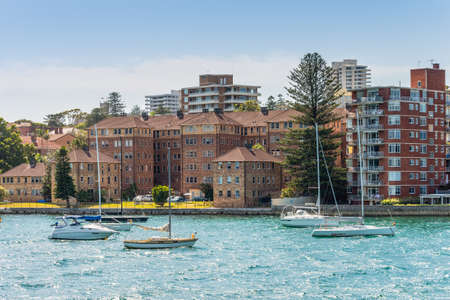 Manly, Australia - November 9, 2014: Sailboats moored in the Manly district bay on Summer day, near Sydney, Australia. Manly is a beach-side suburb of northern Sydney, in the state of New South Wales, Australia.のeditorial素材