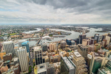 Sydney, Australia - November 11, 2014: Aerial view of Sydney CBD, Cockle Bay and Barangaroo Reserve from Sydney Tower Eyein at cloudy weather, Australia.のeditorial素材