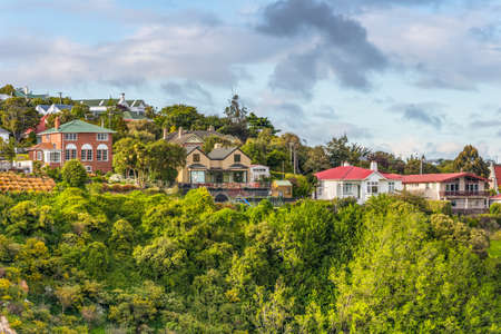 Port Chalmers, New Zealand - November 15, 2014: Houses situated on a hill at Port Chalmers, Dunedin, Otago region, South Island, New Zealand. Living amongst trees is a good way to get oxygen.のeditorial素材