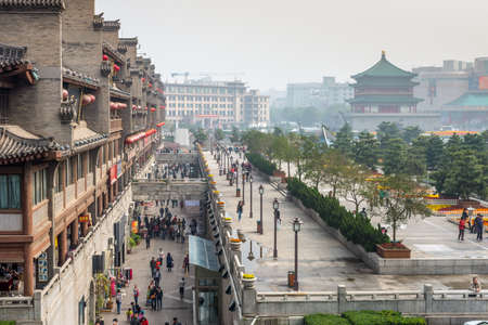 Xian, China - October 17, 2013: View of the square near the Bell Tower in Xian obscured in the smog,...