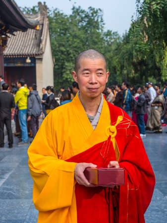 Xian, China - October 17, 2013: Monk at Giant Wild Goose Pagoda, Xi'an, Shaanxi Province, China.のeditorial素材