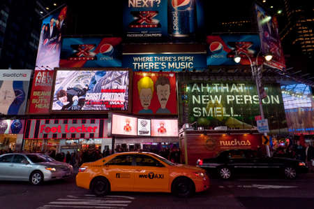 New York City, USA - November 20, 2011: Illuminated facades of Broadway with busy traffic and commercial atmosphere near Times Square in Midtown Manhattan is a symbol of New York City and the United States.のeditorial素材